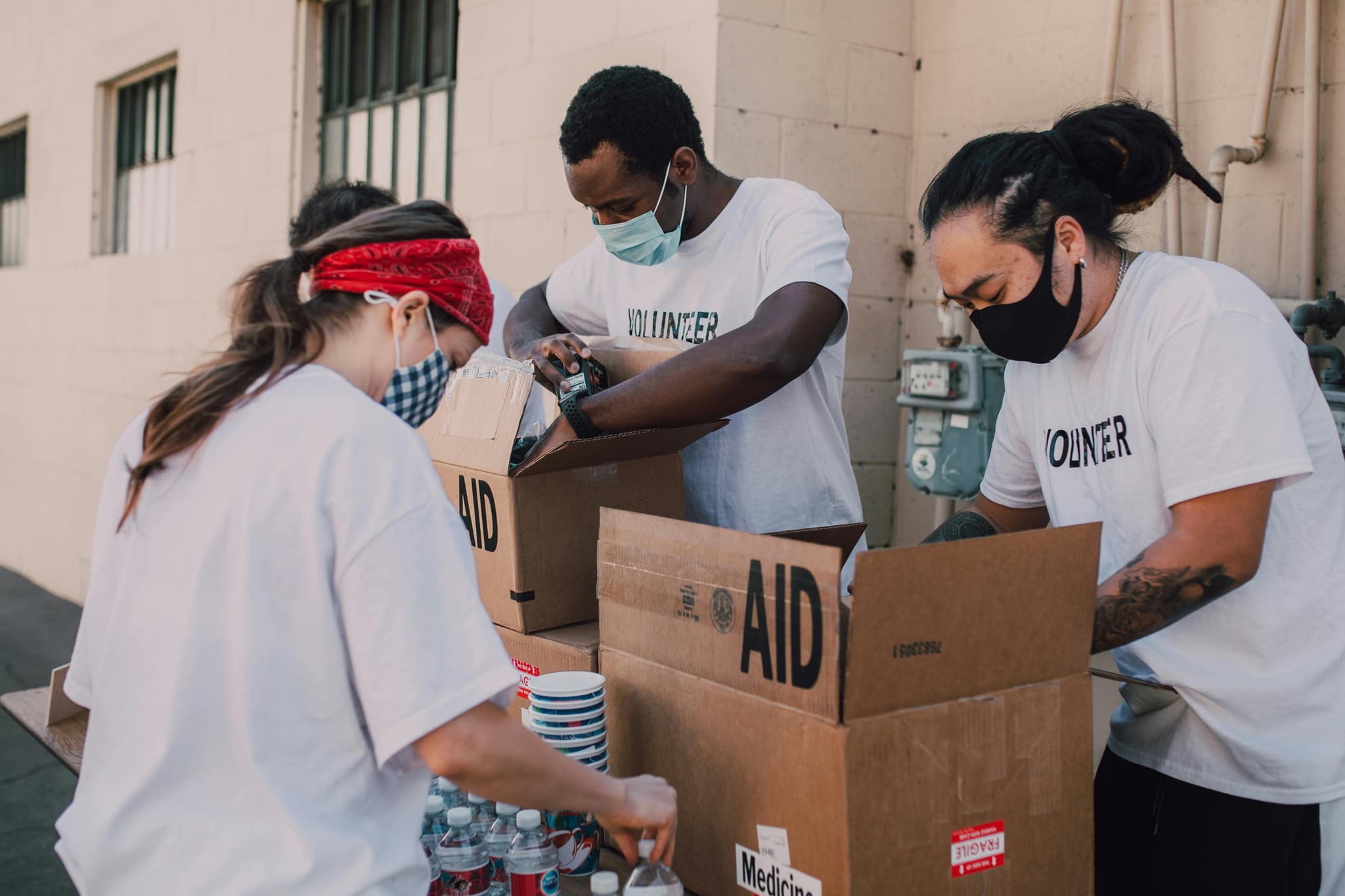Volunteer greeting families during a community donation event